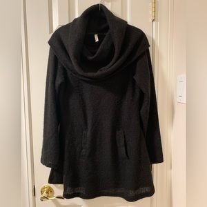 Knit sweater dress/tunic with front pocket detail.